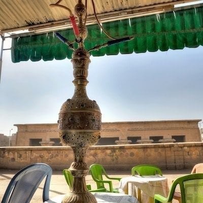 Water pipe in a cafe with view of Khnum Temple