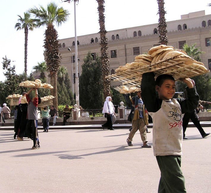 Boy selling bread in the Khan-el-Khalili bazaar