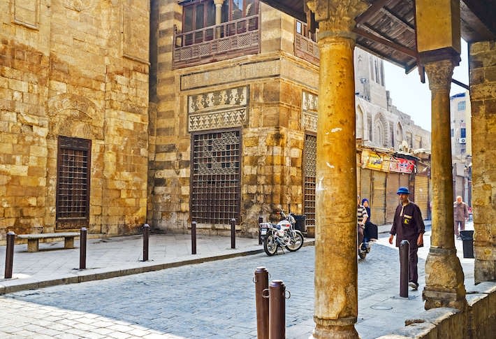Stone walls of the medieval Qalawun complex on the oldest street in Cairo, Al-Muizz Street