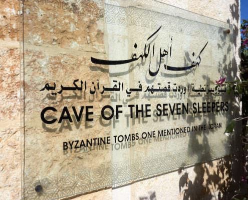 The signboard at the entrance to the Cave of the Seven Sleepers in Amman, Jordan