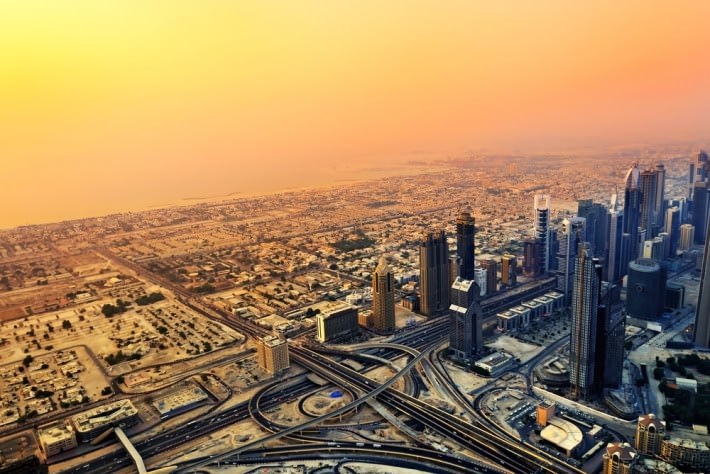 Dubai skyline along Sheikh Zayed Road at sunset