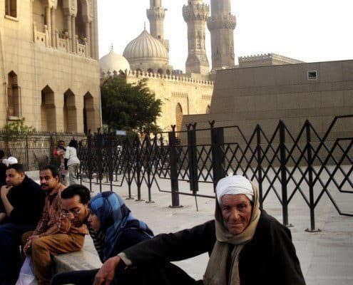 People sitting outside Al-Azhar Mosque in Cairo