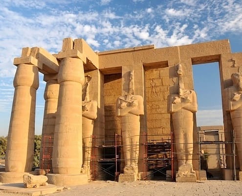 Giant Osiris statues in the second court of the Ramesseum undergoing renovation work