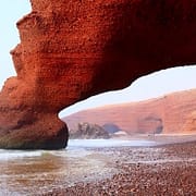 Agadir Attractions - Red archs on Atlantic Ocean coast. Agadir, Morocco