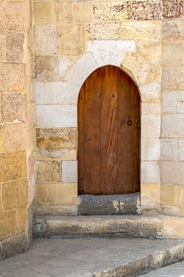 Vaulted door on exterior stone bricks wall of Amir Aqsunqur Mosque (Blue Mosque)