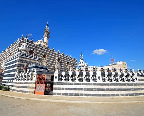 Abu Darwish Mosque with its alternating black and white stones inherit the traditional Levantine architecture