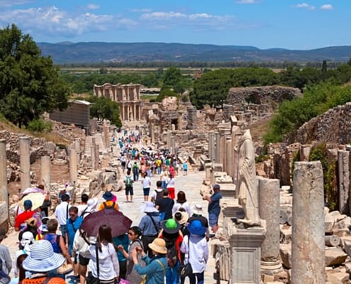 Tourists visiting the Greek-Roman ruins of Ephesus