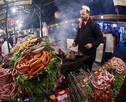 Places to Eat in Morocco and Jordan - Street food stall by night at the Djemaa el Fna square in Marrakesh on October 8, 2013 in Morocco. Every night the square turns into open air restaurant
