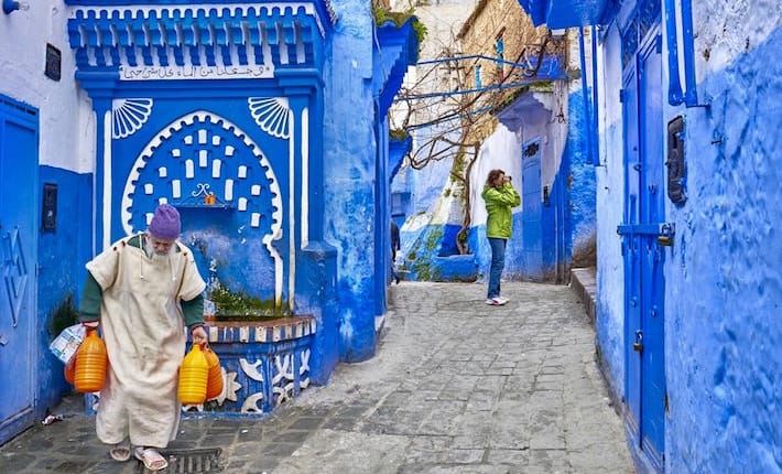 CHEFCHAOUEN, MOROCCO - FEBRUARY 22- Unidentified local man carries water from the well