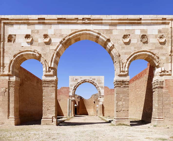 The beautiful ancient Roman arch ruins at Qasr Al-Mshatta Umayyad Palace in Jordan