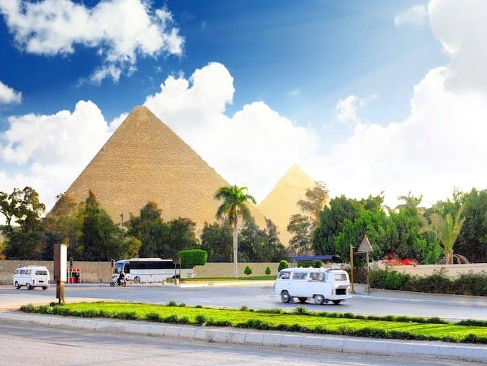 Ancient Great Pyramids and present day of Giza town,suburb of Cairo city. Egypt.