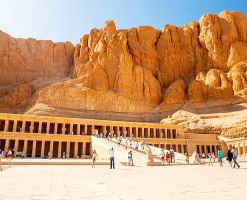 Luxor Egypt Vacation Packages - Tourists at the Mortuary Temple of Queen Hatshepsut which was dedicated to the Sun God Amon-Ra