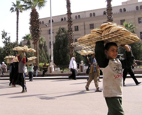 Boy selling bread in the Khan-el-Khalili bazaar