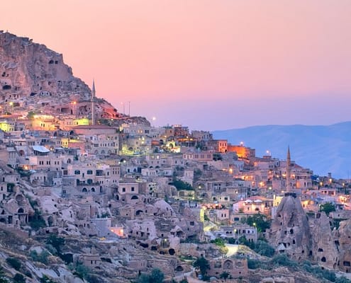 Nevsehir cave city in Cappadocia, Turkey at sunset