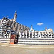 Abu Darwish Mosque with its alternating black and white stones inherit the traditional Levantine architecture