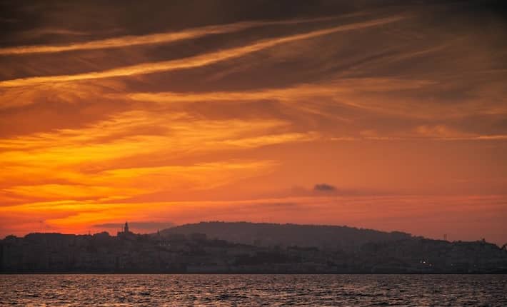 Tangier Morocco Tourist Attractions - Atlantic ocean coast, red sunset in Tangier