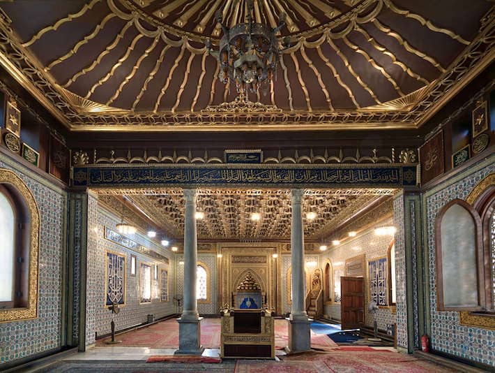 Interior of public mosque of Manial Palace of Prince Mohammed Ali with wooden golden ornate ceilings with design based on old logo of the Ottoman empire, Cairo, Egypt