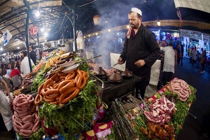 Places to Eat in Morocco and Jordan - Street food stall by night at the Djemaa el Fna square in Marrakesh on October 8, 2013 in Morocco. Every night the square turns into open air restaurant